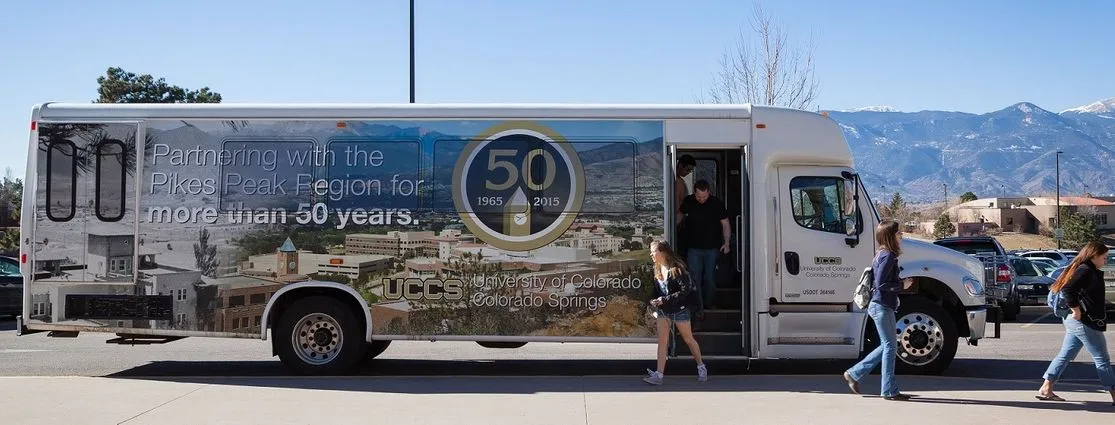 Students getting off UCCS shuttle bus.